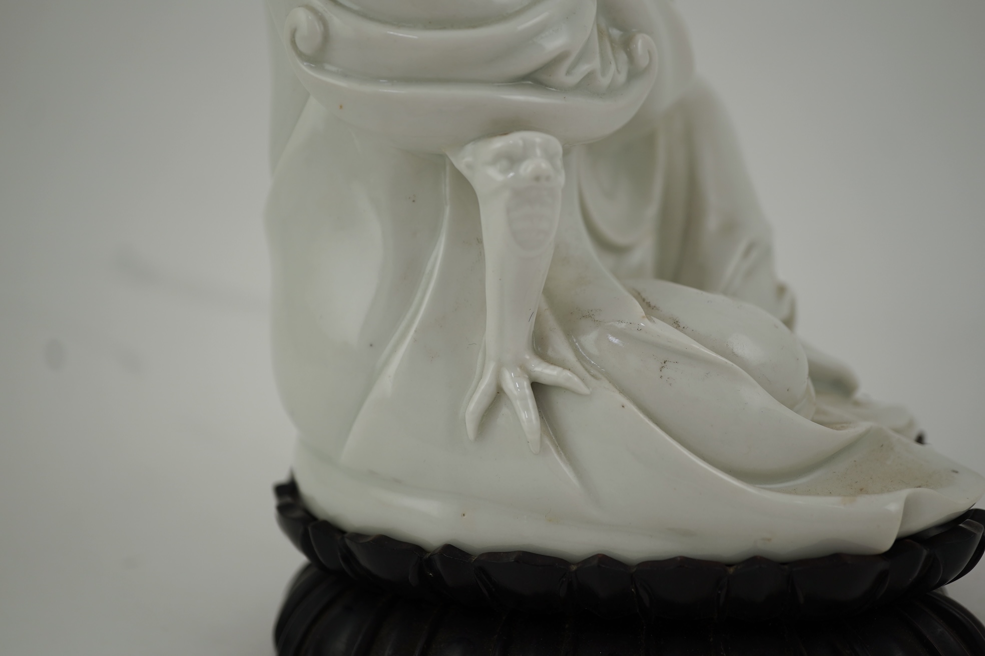 A Chinese blanc-de-chine seated figure of Guanyin, late 19th/early 20th century